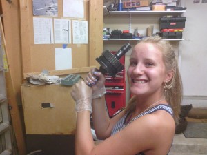 Jackie hoisting the output shaft, getting ready for installation into thw transmission case.