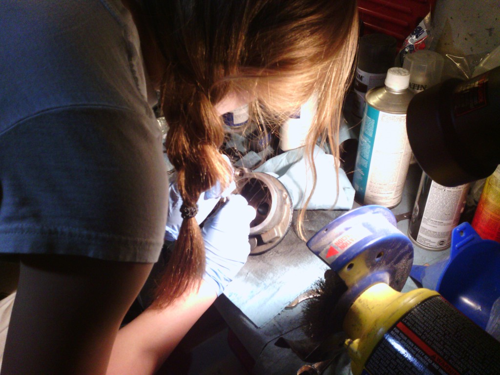 Jackie replacing the inner o-ring seals on the power steering pump.  The old o-rings were hardened and brittle and simply broke apart when being removed, which was not surprising since they were 38-years old!
