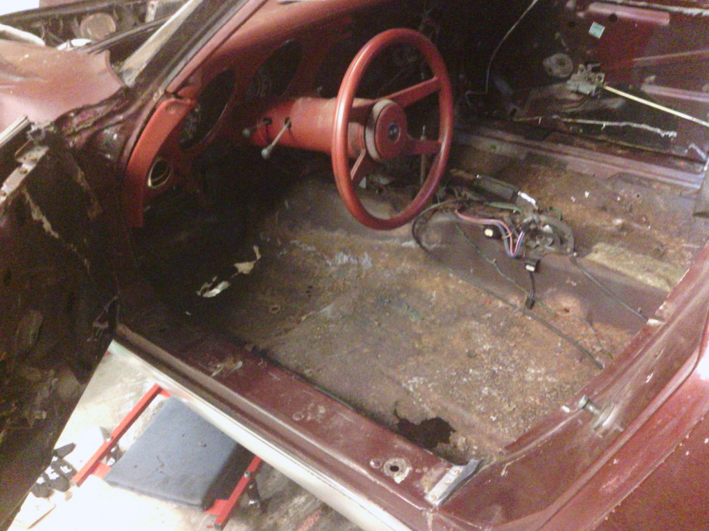 Only the instrument cluster, upper dash pad, A-pillars, and upper windshield trim remain.  Unfortunately many of the screws in the upper windshield trim and A-pillars are rusted solid and will need to be drilled out.